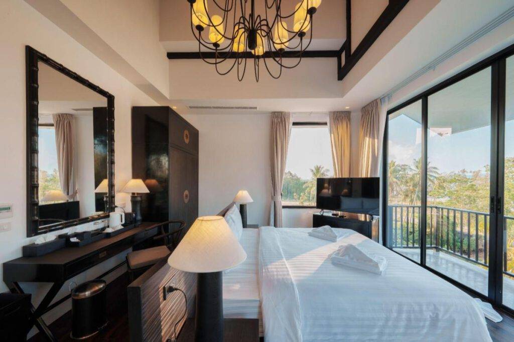luxury pool villa boasts four large suites, and living room.