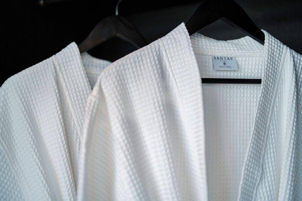 "Soft and plush bathrobes elegantly displayed in the room, inviting guests to indulge in comfort."