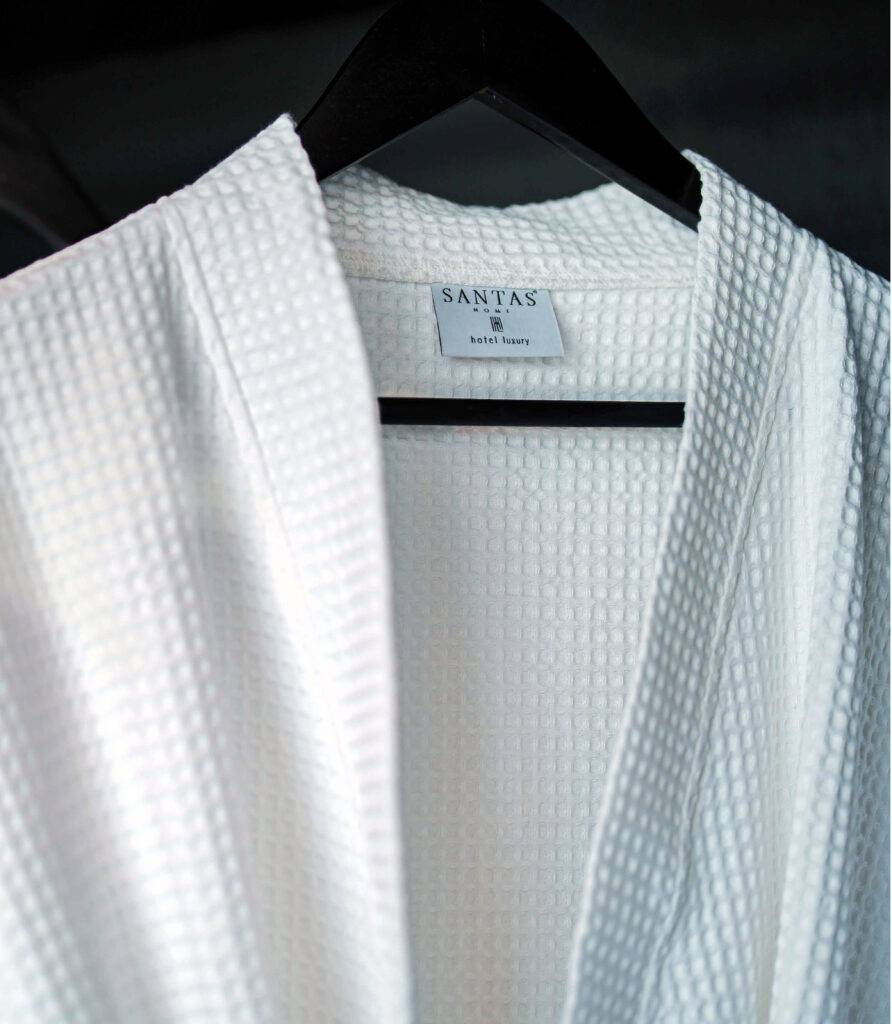 "Soft and plush bathrobes elegantly displayed in the room, inviting guests to indulge in comfort."