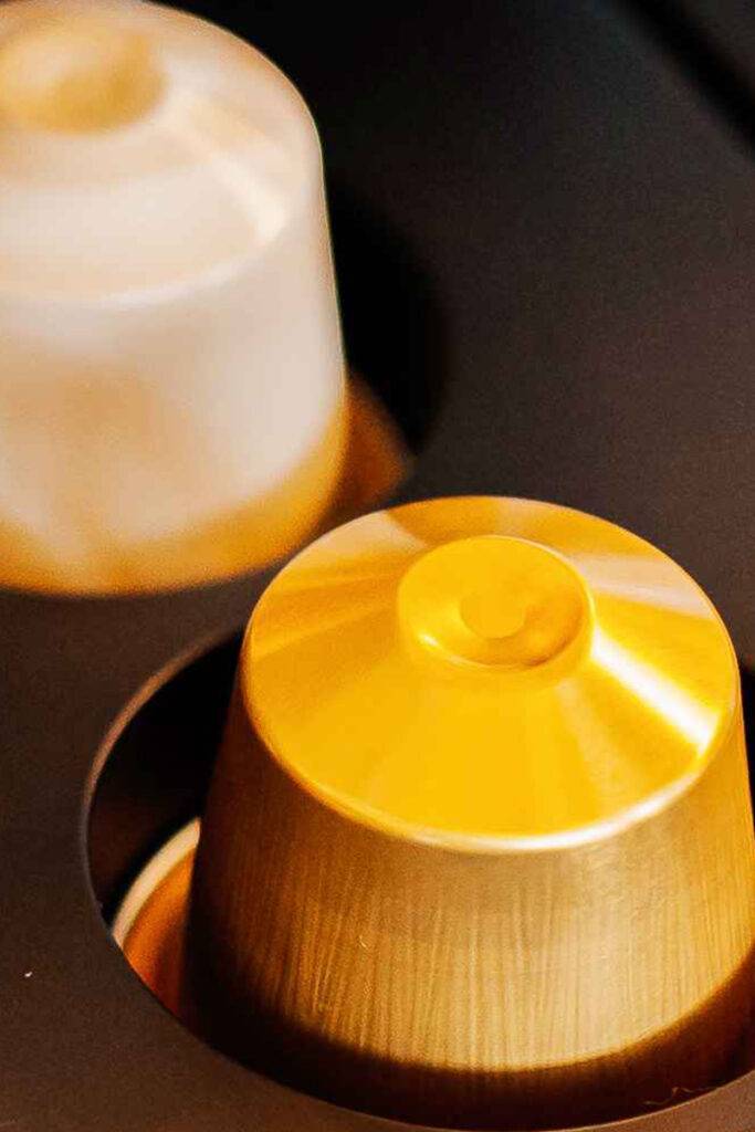 "Close-up of a sleek Nespresso machine, ready to brew the perfect cup of coffee."