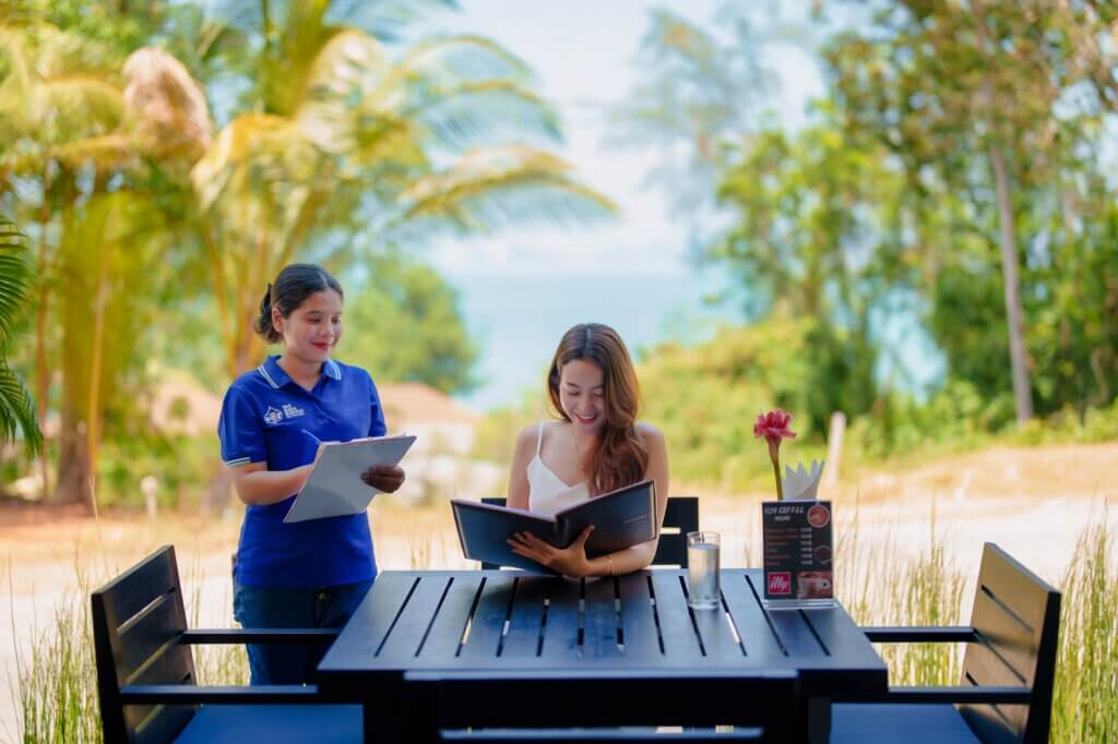 Our team taking an order at The Funky Monkey Restaurant, Yao Bada Badoo, Koh Yao Yai