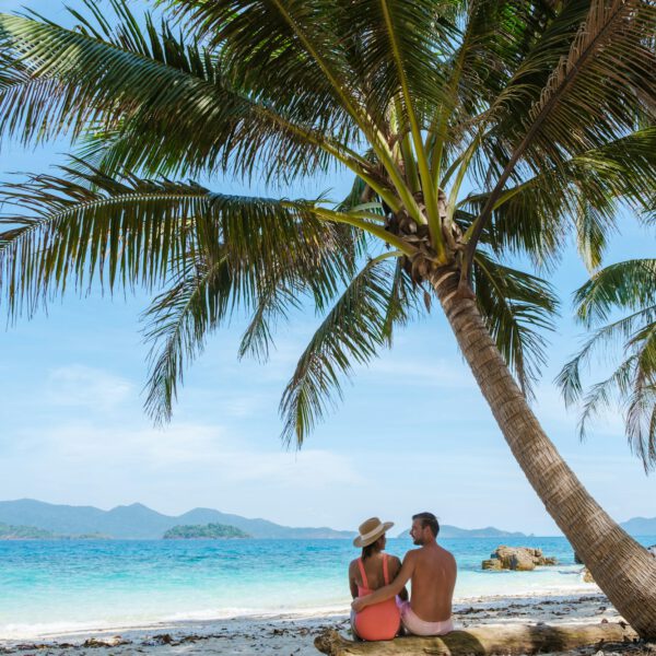 Koh Wai Island Thailand tropical Island near Koh Chang, couple of men and woman on the beach