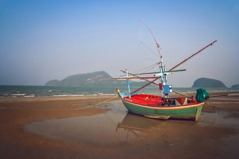 A local fishing boat anchored near the shore in Koh Yao Yai, Thailand