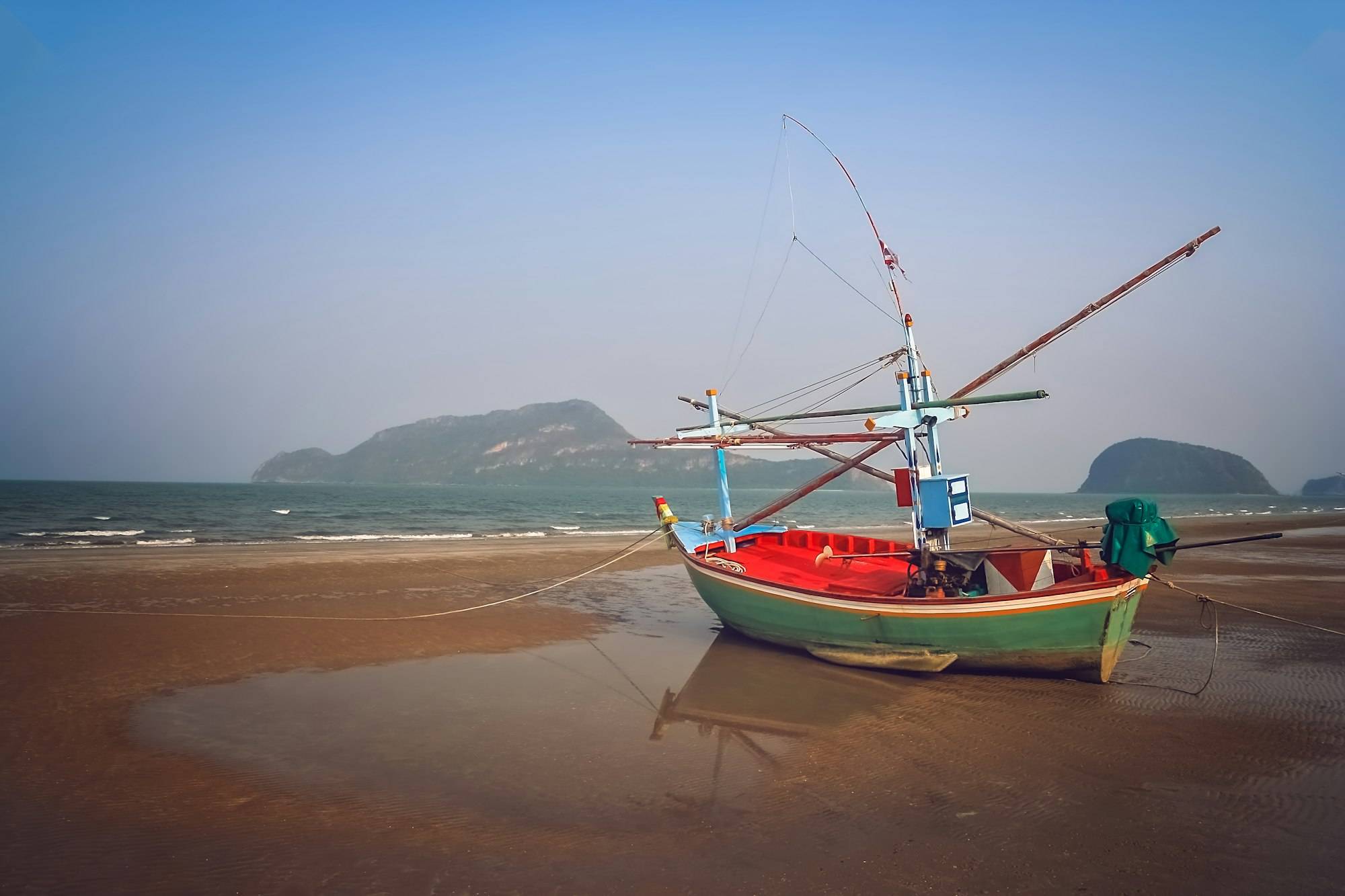 A local fishing boat anchored near the shore in Koh Yao Yai, Thailand
