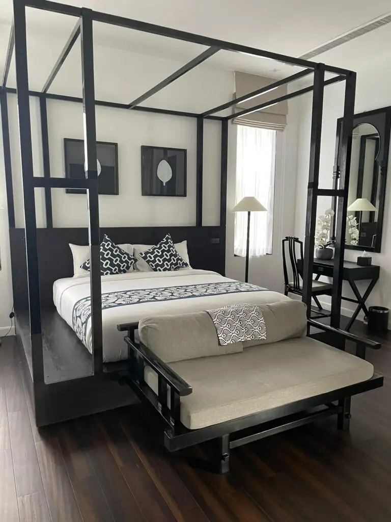 Spacious and elegant Grande Deluxe Suite with king size bed overlooking the pool